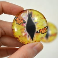 Žute zmajeve staklene oči sa leptirima monarha